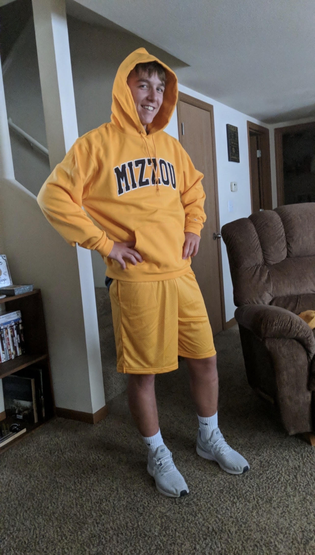 Banana Brett dressed in a bright yellow Mizzou hoodie and shorts